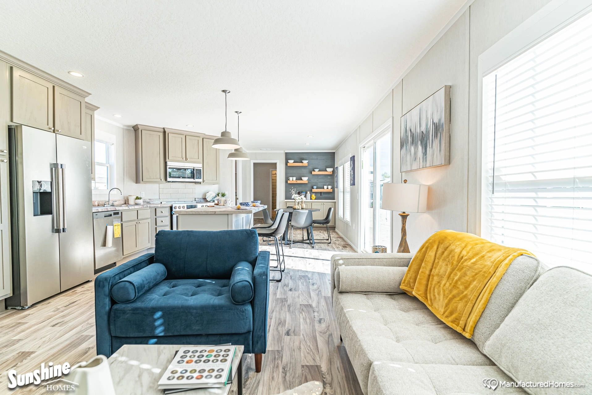 A living room with a couch , chair , and coffee table.