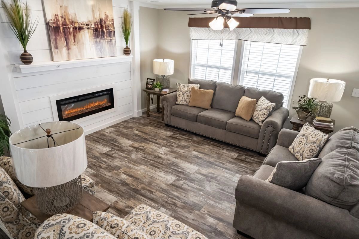 A living room filled with furniture and a fireplace.