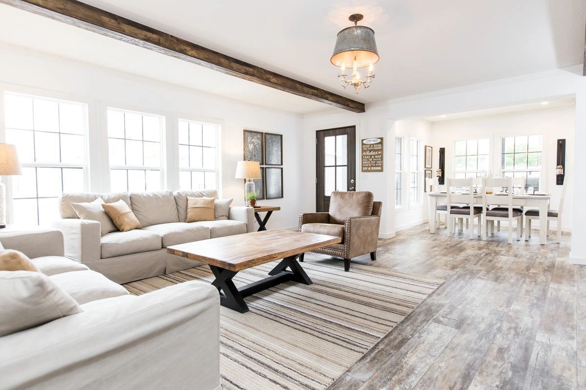 A living room filled with furniture and a coffee table.