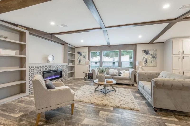 A living room filled with furniture and a fireplace.
