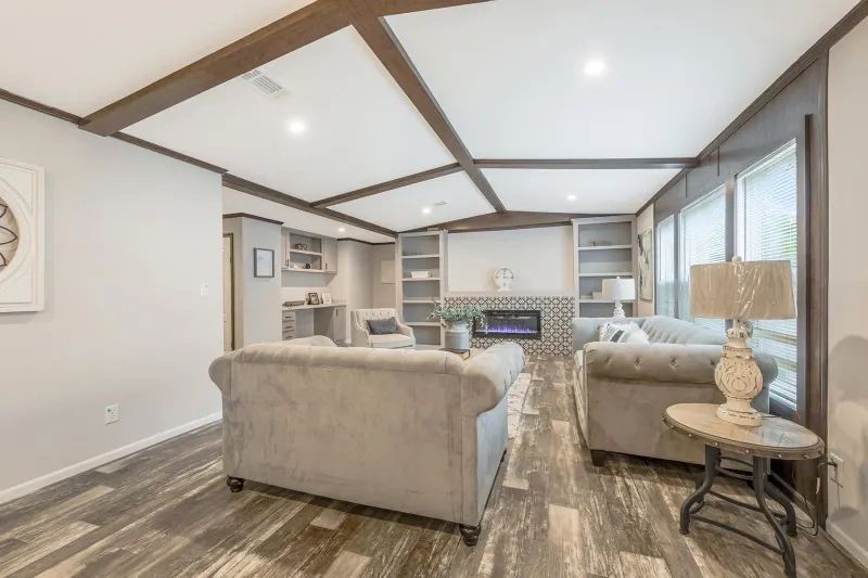 A living room filled with furniture and a fireplace.