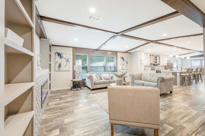 A living room filled with furniture and a fireplace.