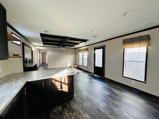 A kitchen with a large island in the middle of the room.
