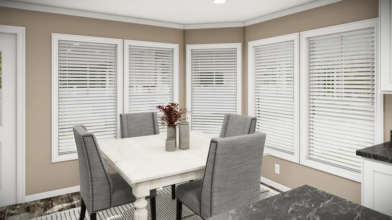 A dining room with a table and chairs and blinds on the windows.