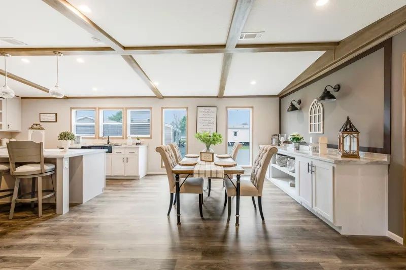 There is a dining room table and chairs in the middle of the room.