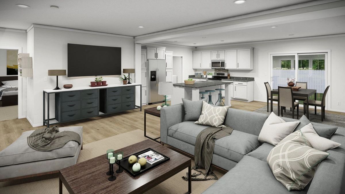 A living room with a couch , coffee table , and television.