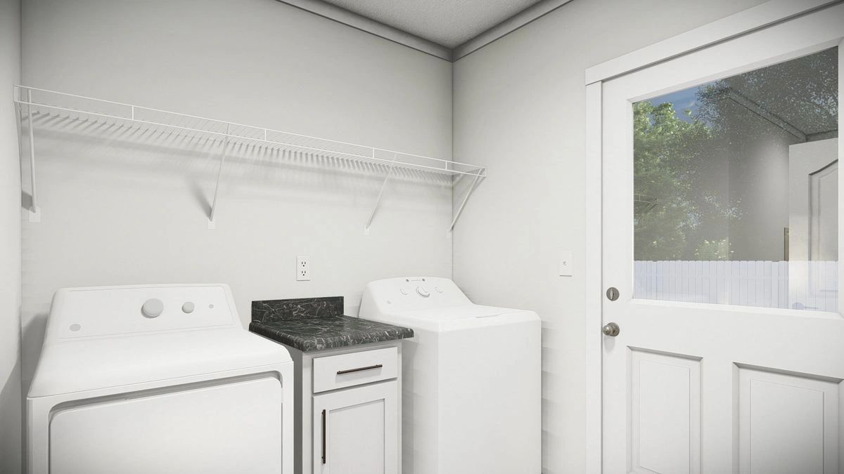 A laundry room with a washer and dryer and a door.