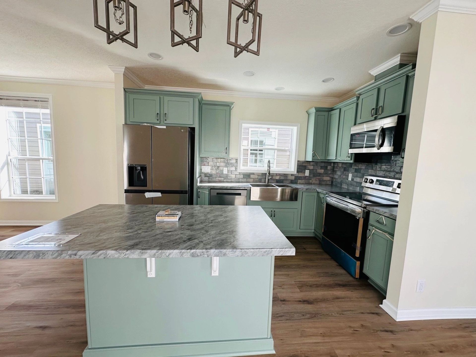 There is a large island in the middle of the kitchen.