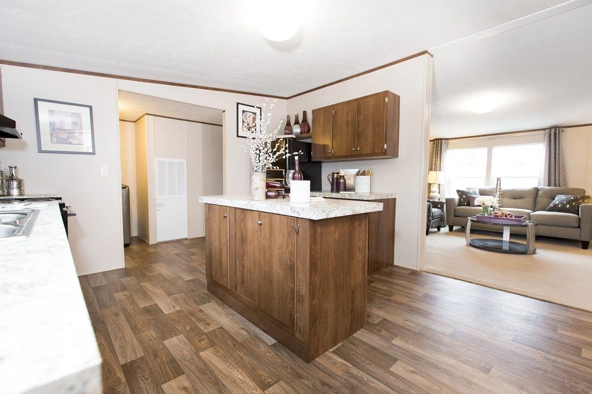 A kitchen with a large island in the middle of the room.