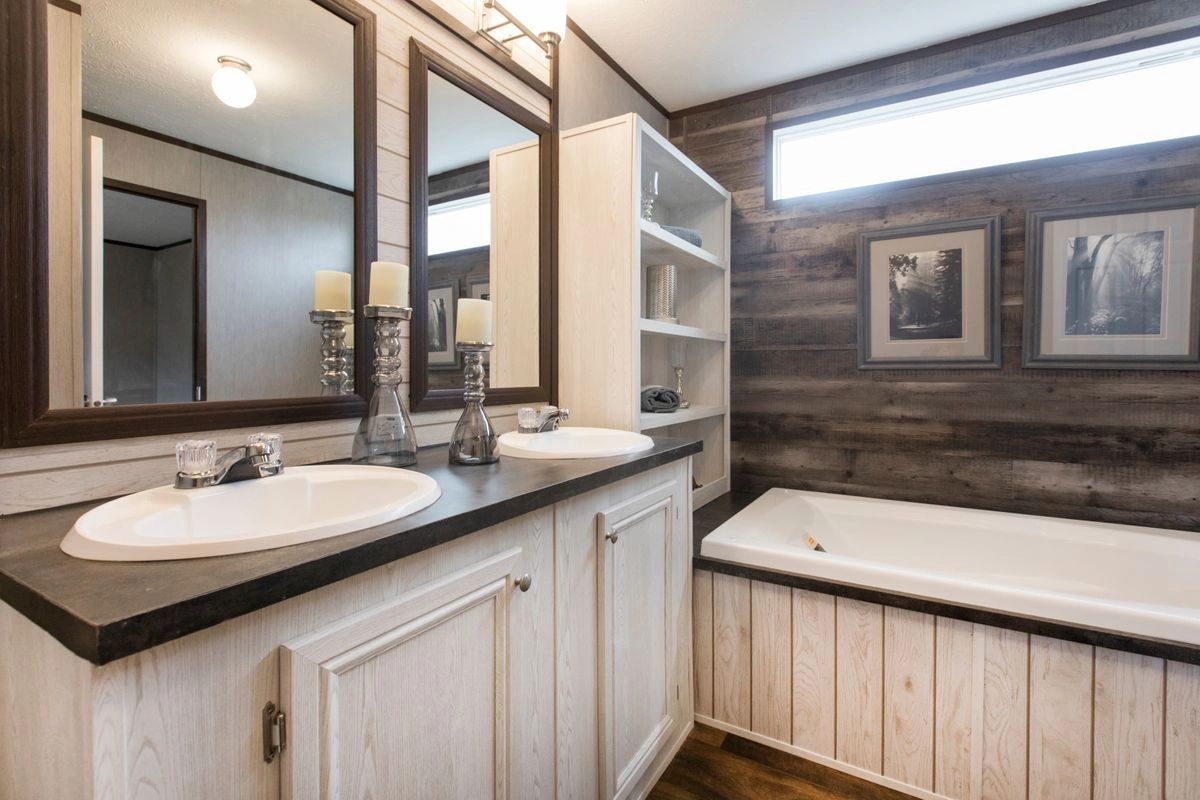 A bathroom with two sinks and a bathtub.