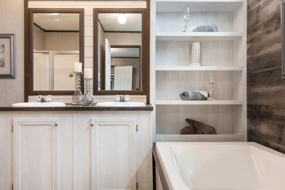 A bathroom with two sinks and a bathtub.