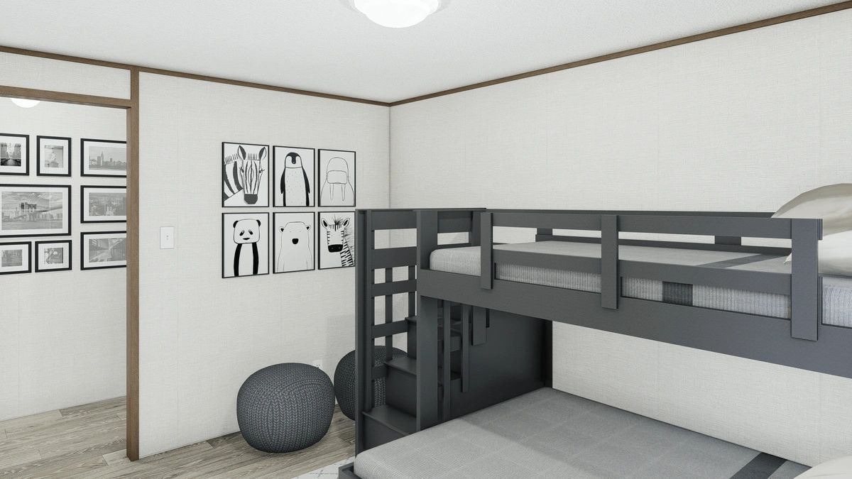 A bedroom with a bunk bed and a picture on the wall.