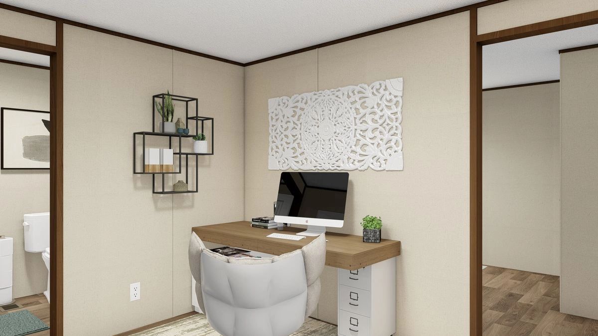 A room with a desk and chair and a computer on it.