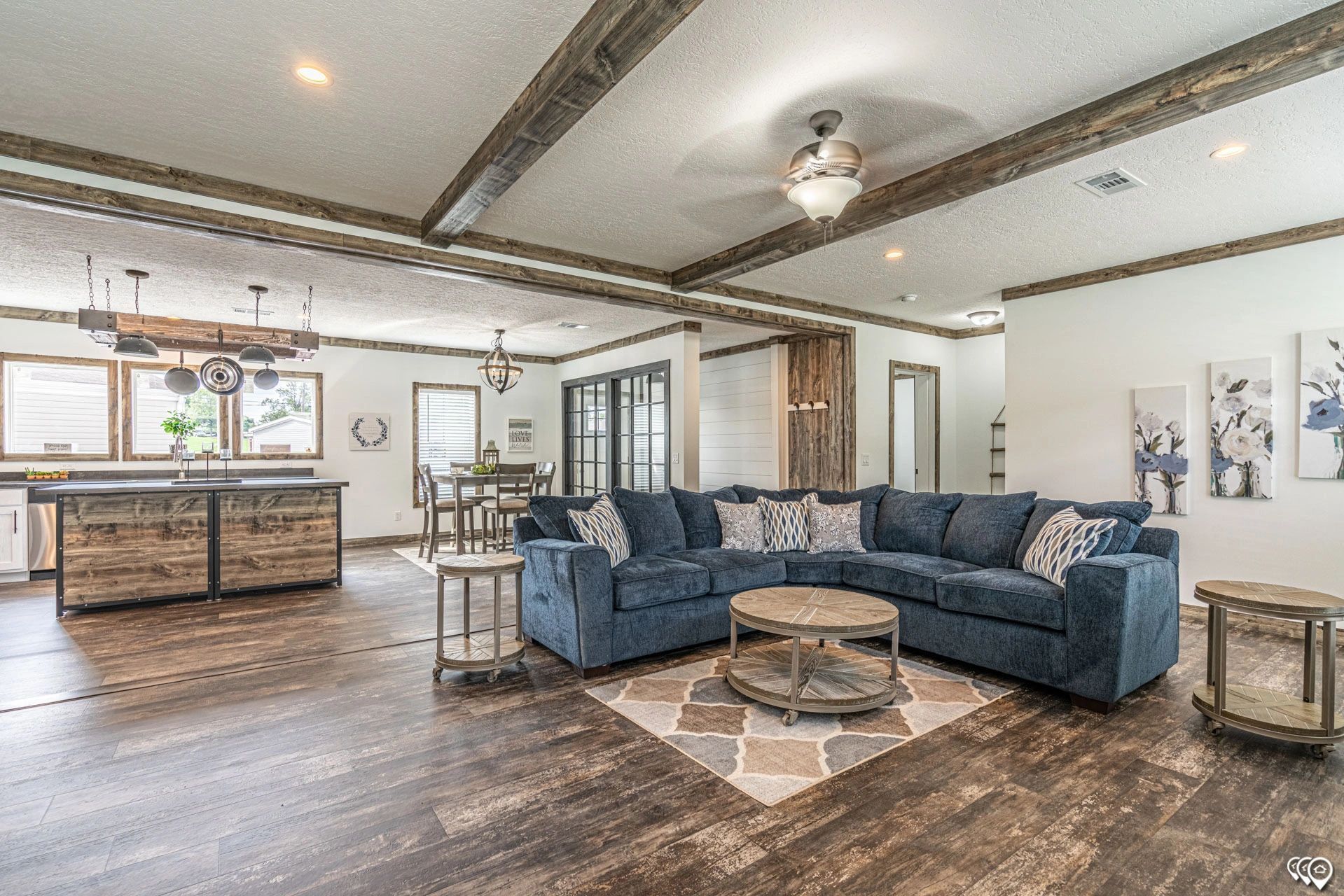 A living room filled with furniture and a ceiling fan.
