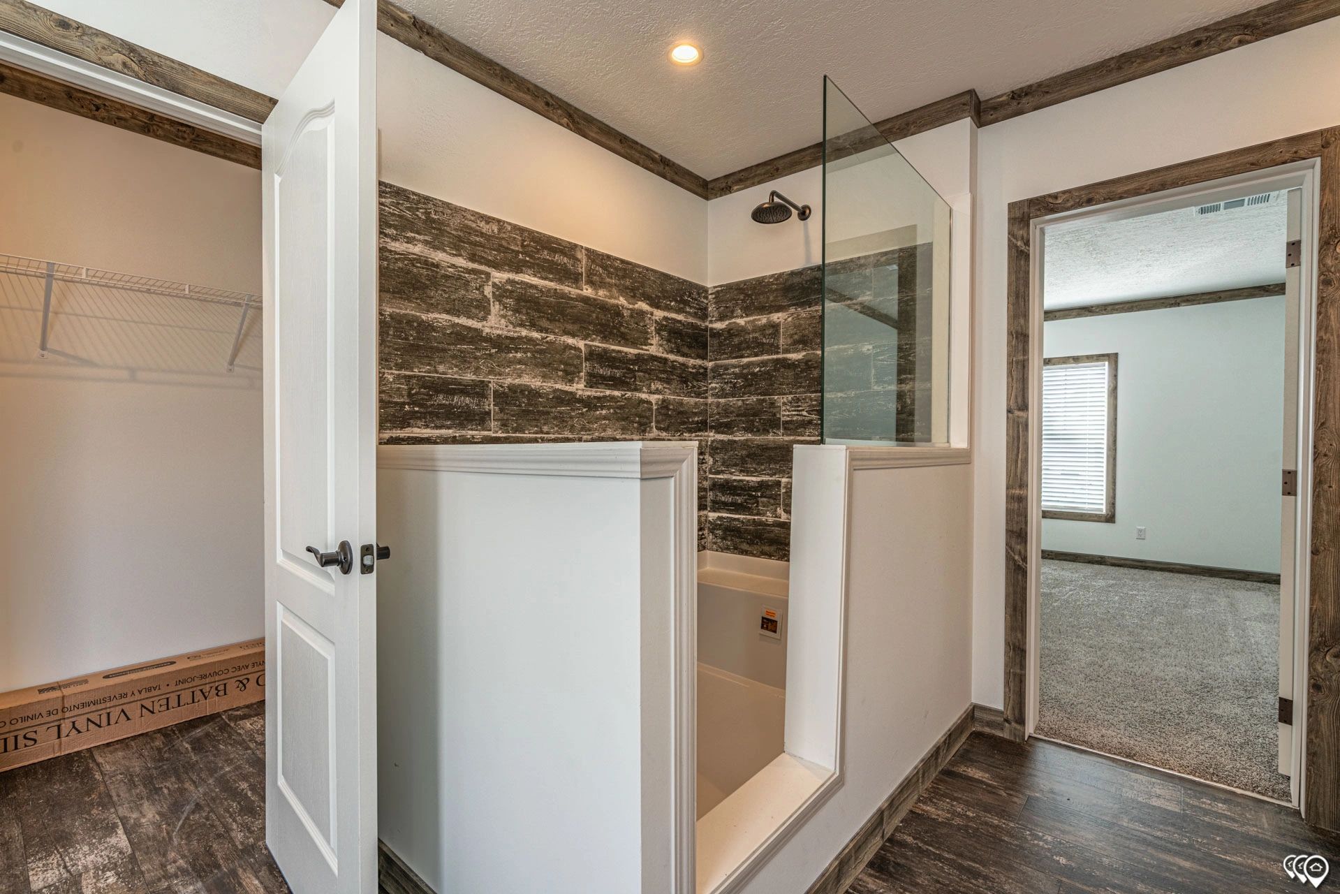 A bathroom with a tub and a walk in shower.