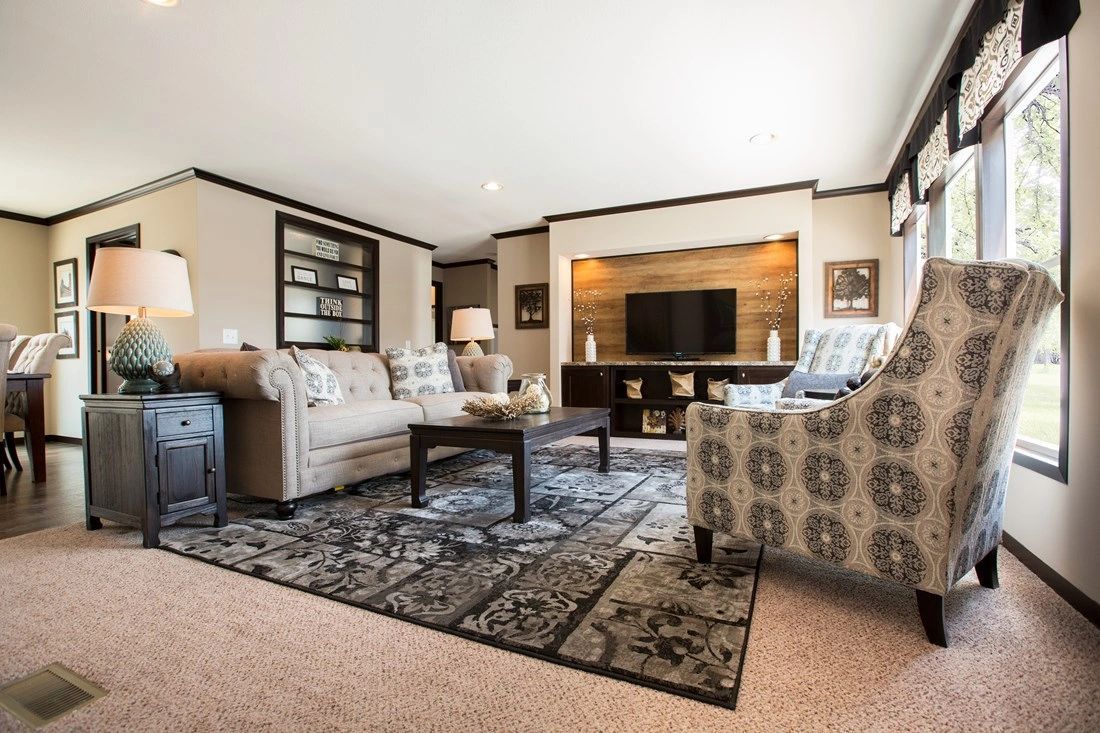 A living room filled with furniture and a television.