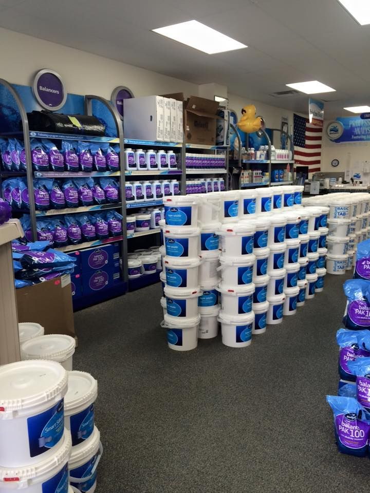 A store filled with lots of buckets and bags of chemicals