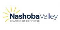 Nashoba Valley Chamber of Commerce logo with the name and a sun-like burst design in yellow.