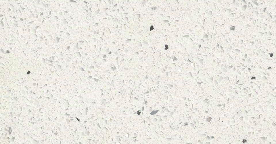 Light gray speckled surface with small dark flecks