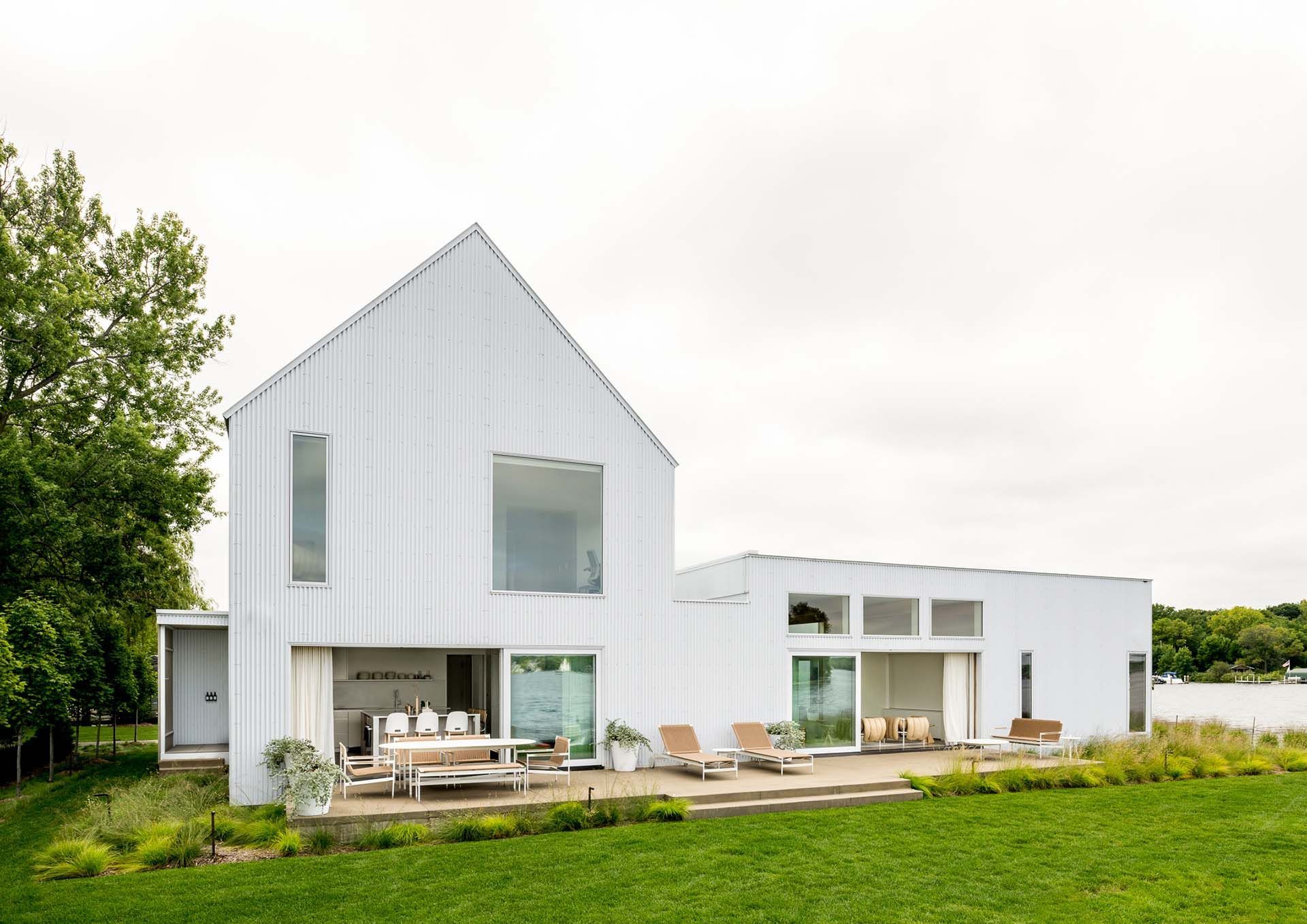 View of modern white house - back patio area