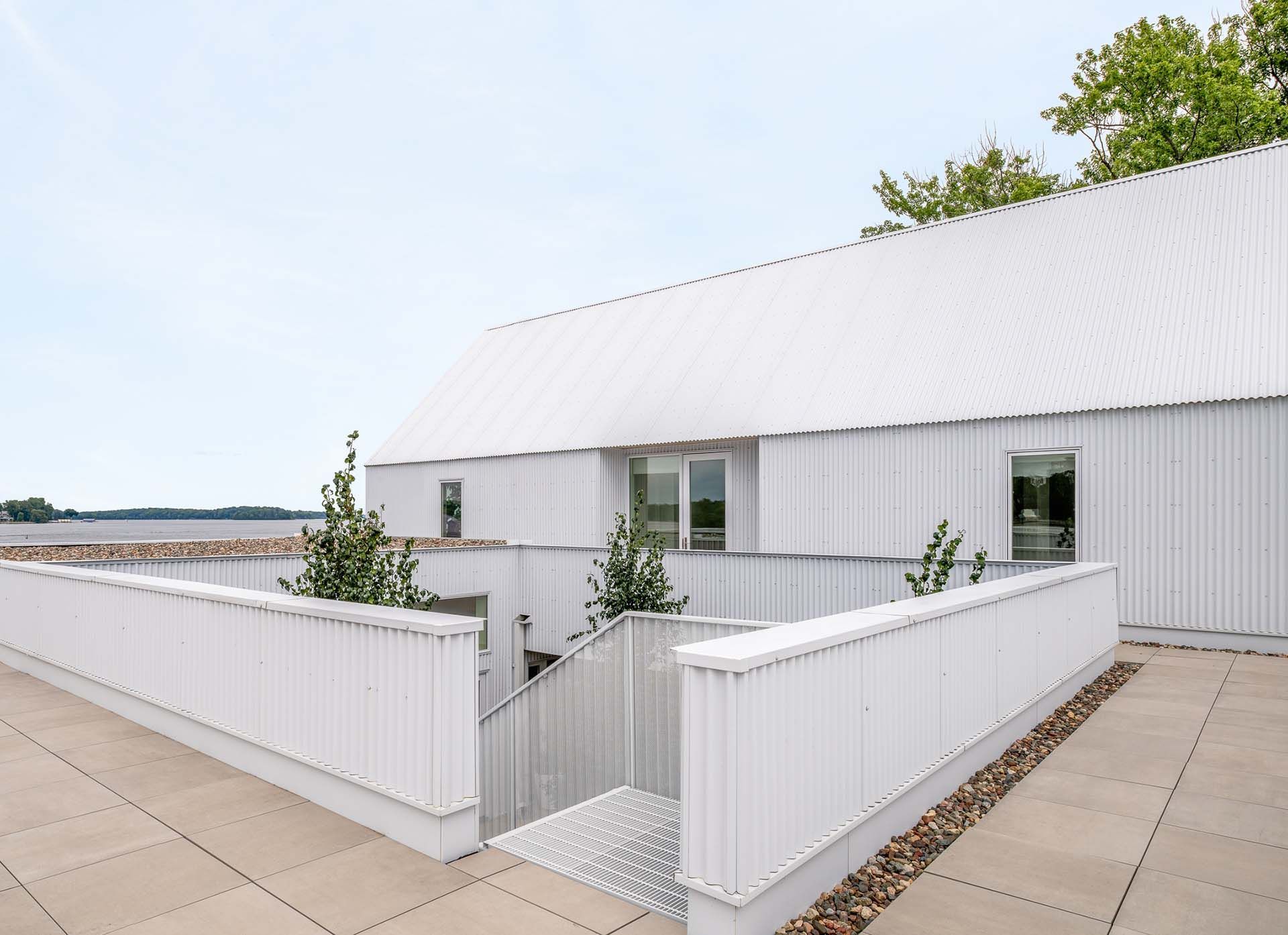 A white home with stairs leading up to it