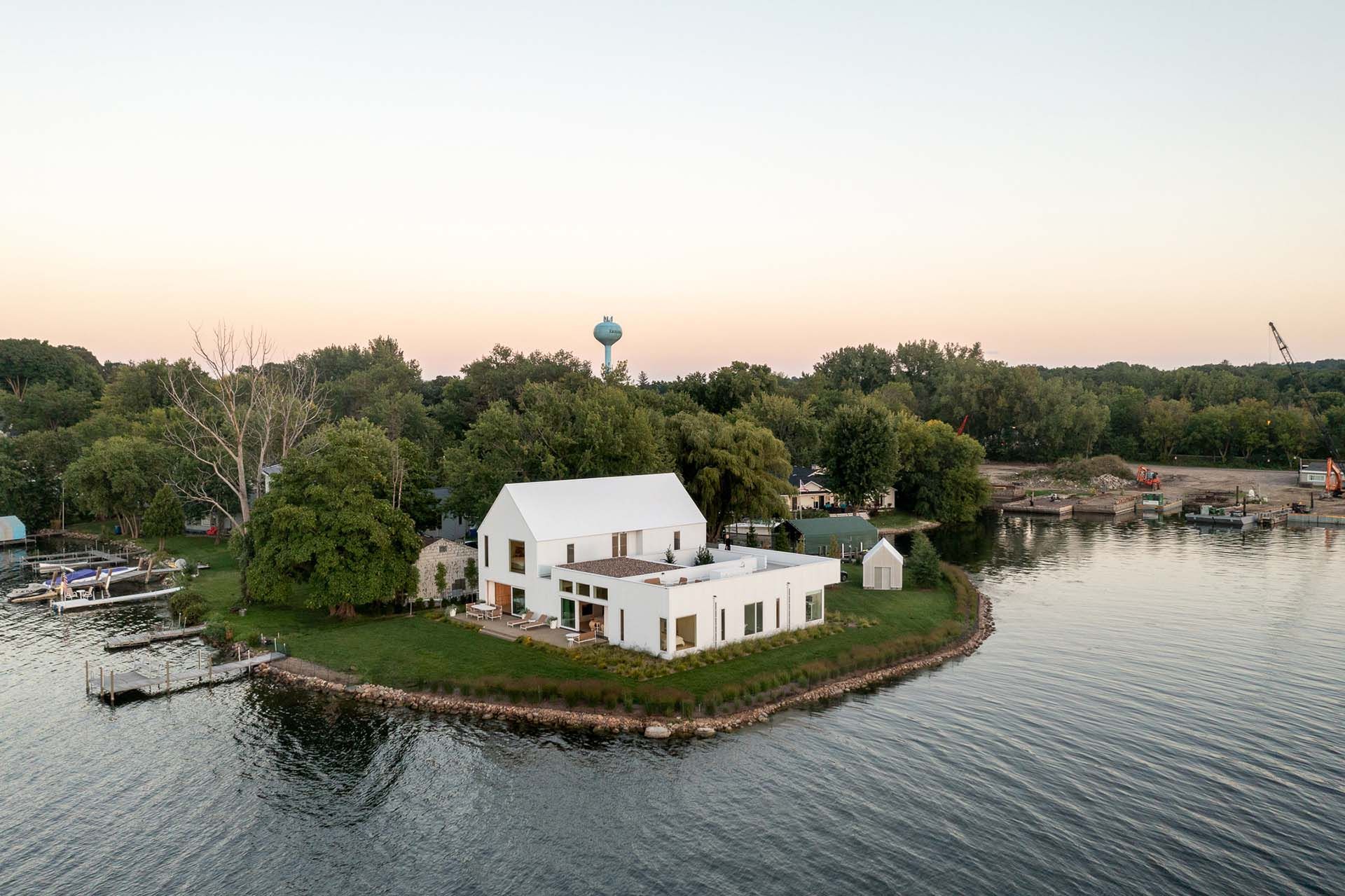 An aerial view of a custom home on the lake