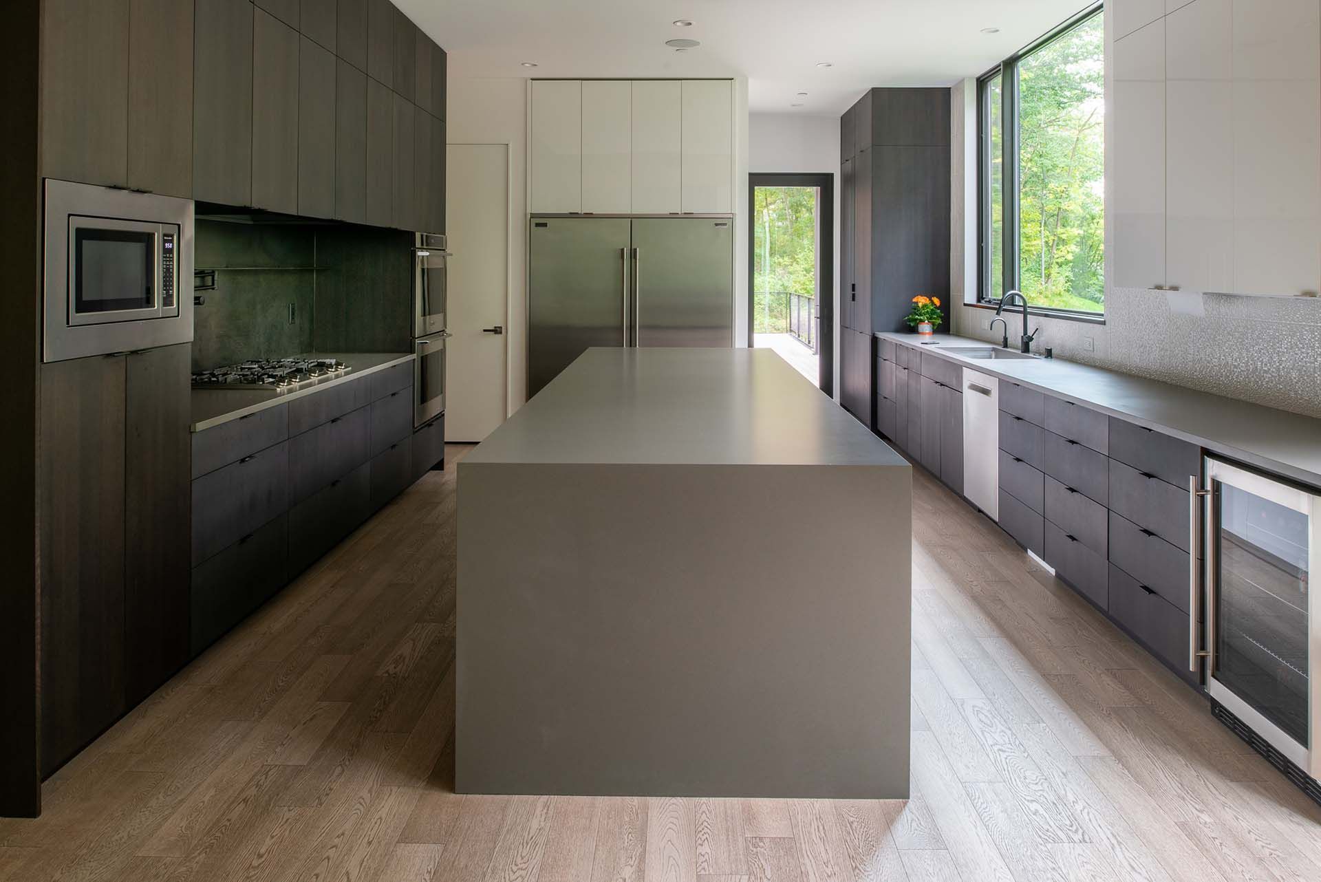 There is a large island in the middle of the kitchen.