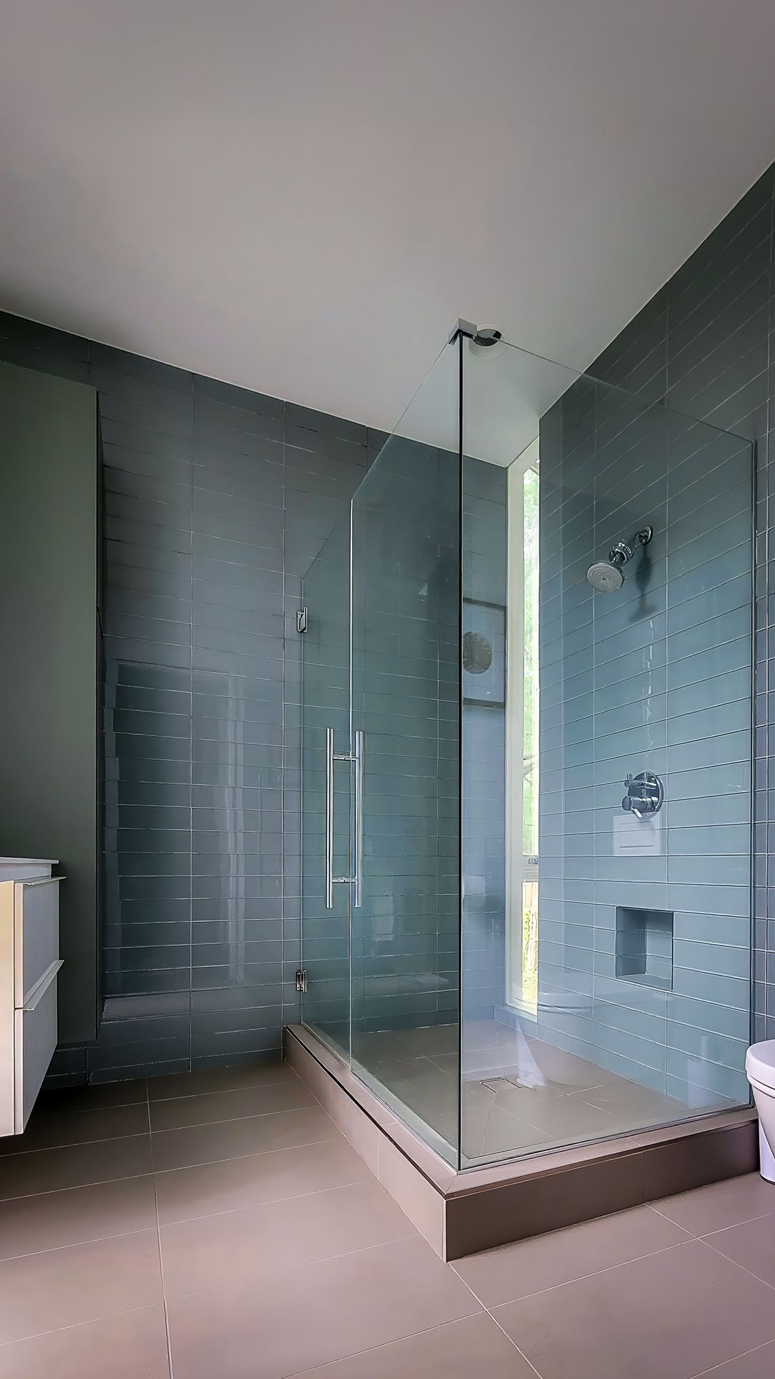 a bathroom with a walk-in shower and a toilet