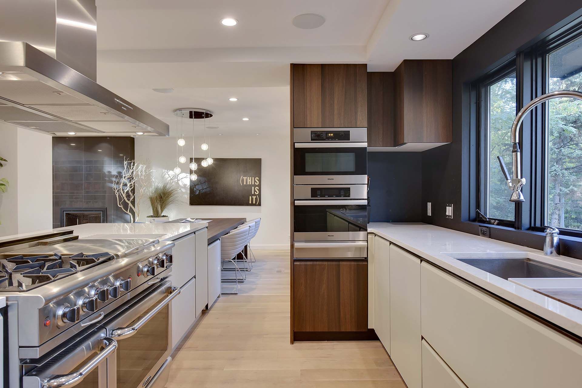 A kitchen with stainless steel appliances and wooden cabinets