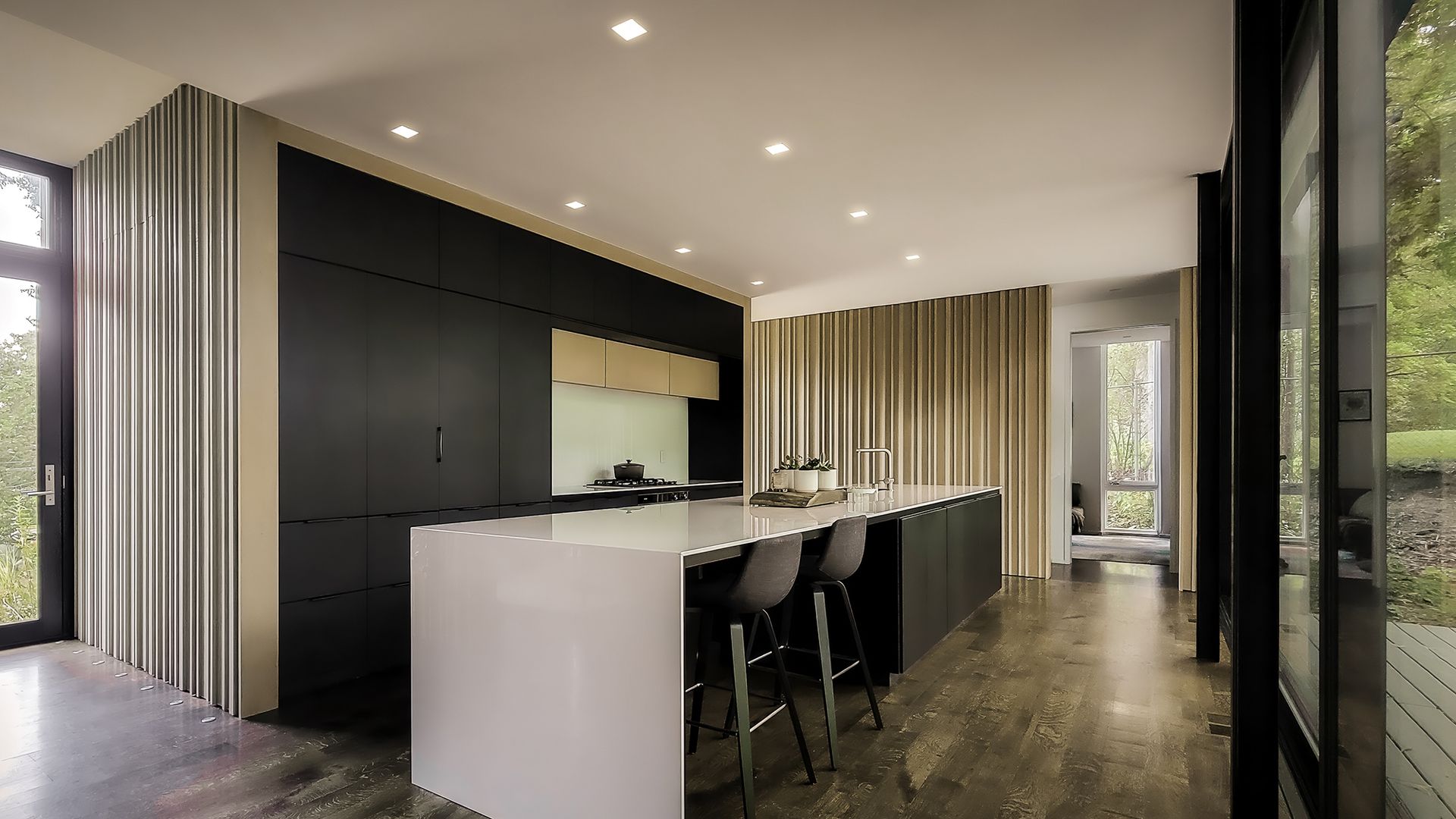 a kitchen with a large island in the middle of it