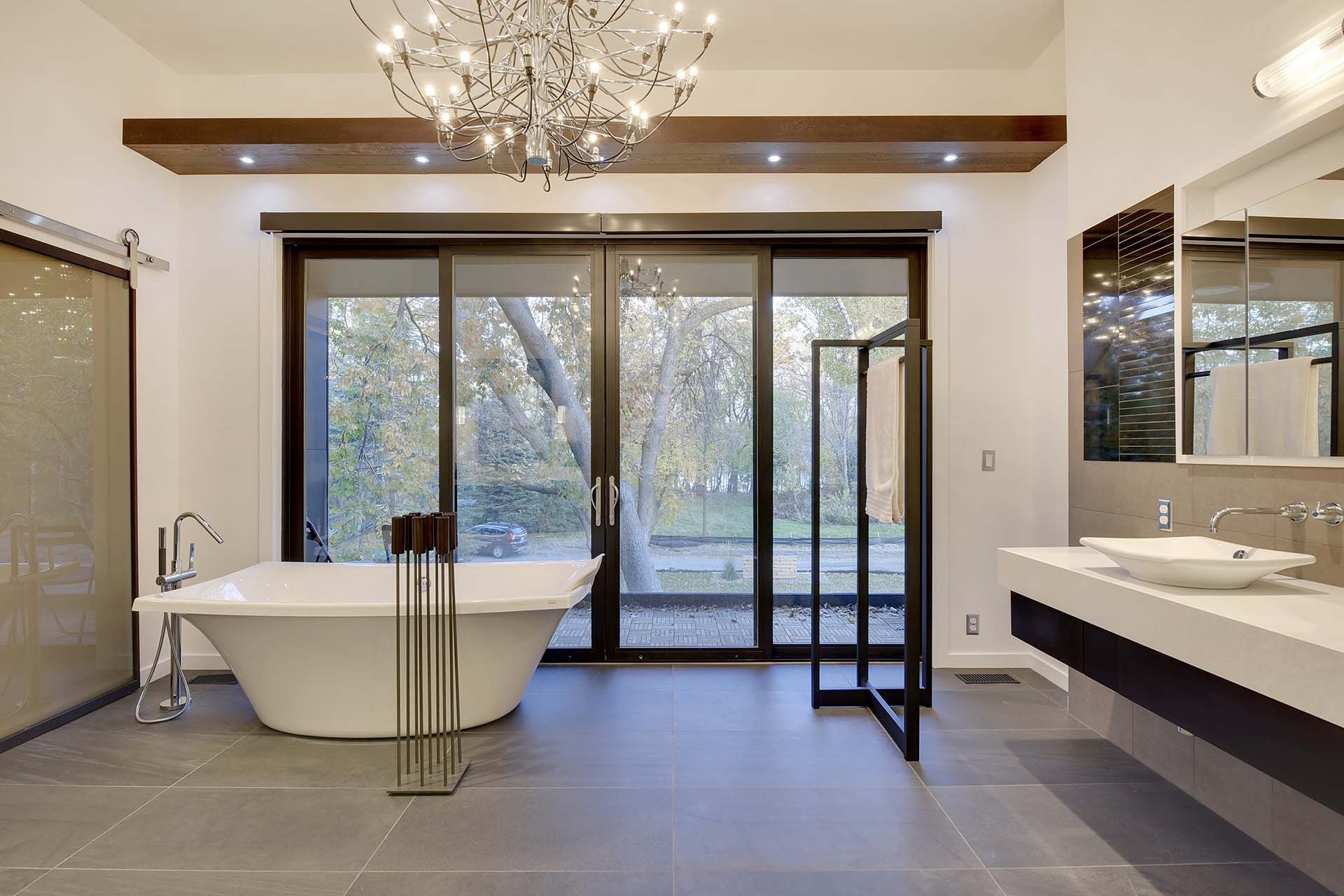 A bathroom with a bathtub and two sinks