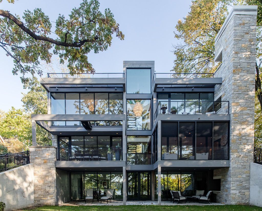 A large house with a lot of windows and a chimney