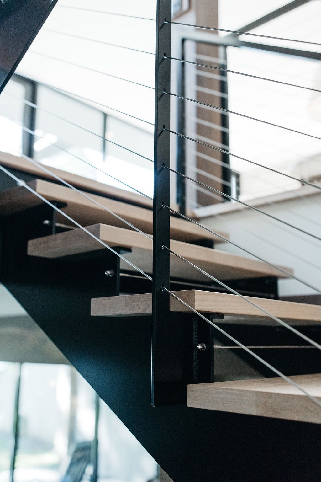 A staircase with wooden steps and a metal railing