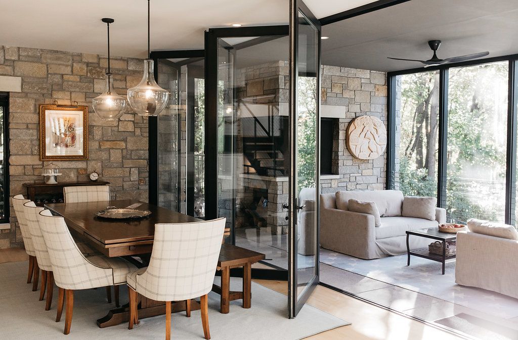 There is a dining room table and chairs in the middle of the room.