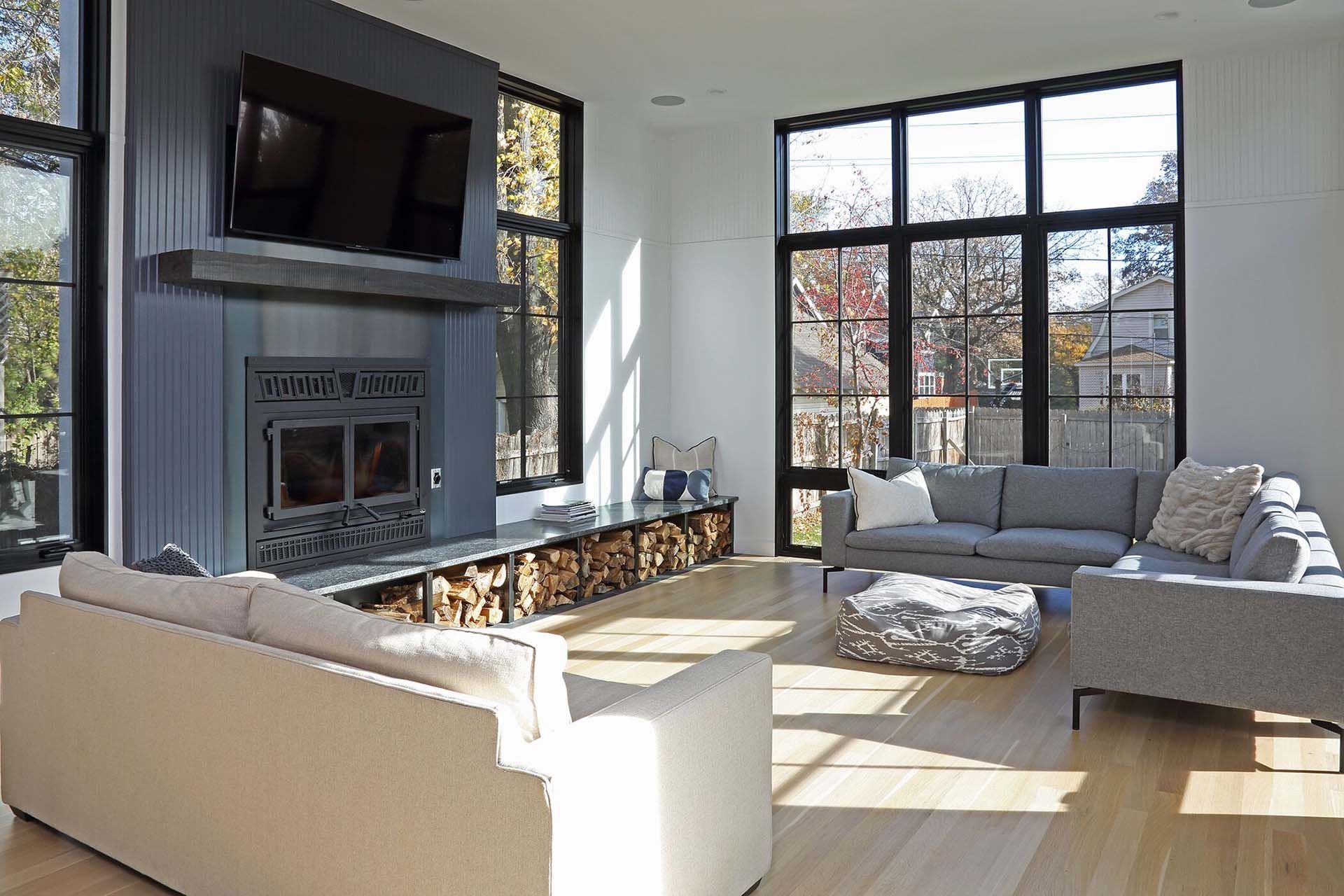 A living room filled with furniture and a fireplace.