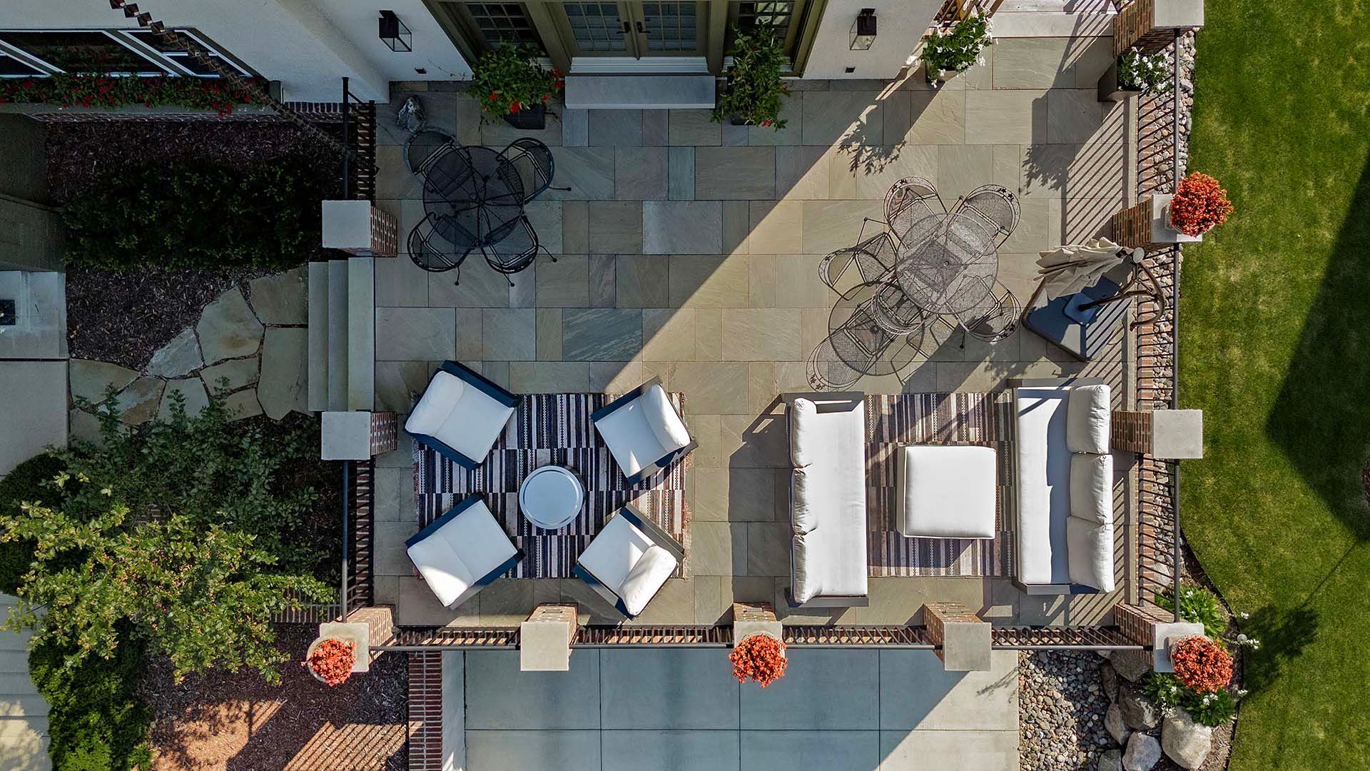 An aerial view of a patio with a table and chairs