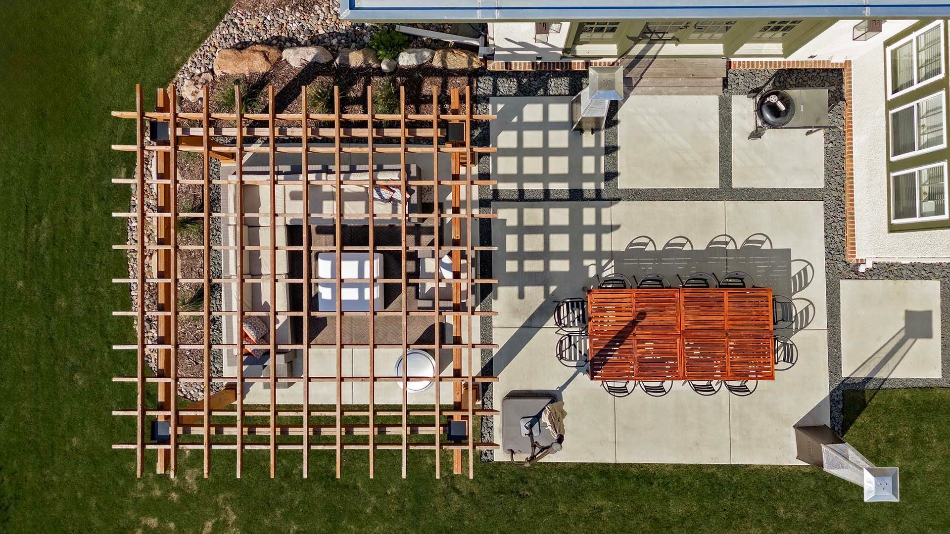 An aerial view of a patio with a table and chairs