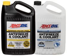 Two gallons of amsoil antifreeze and coolant are sitting next to each other.