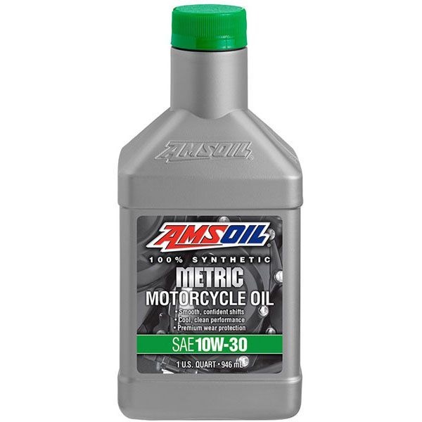 A bottle of amsoil metric motorcycle oil with a green cap