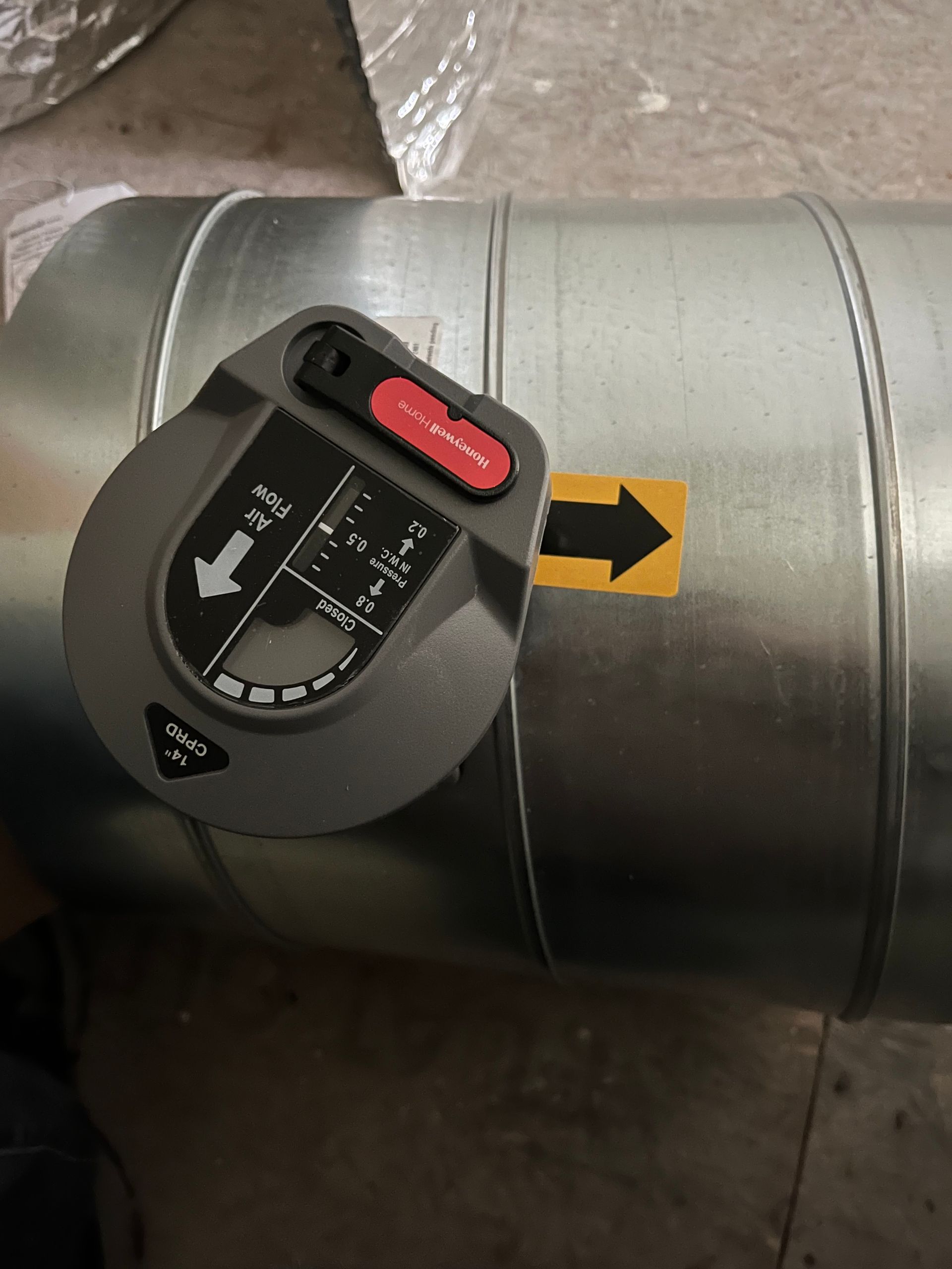 A close up of a metal pipe with an arrow pointing to the right