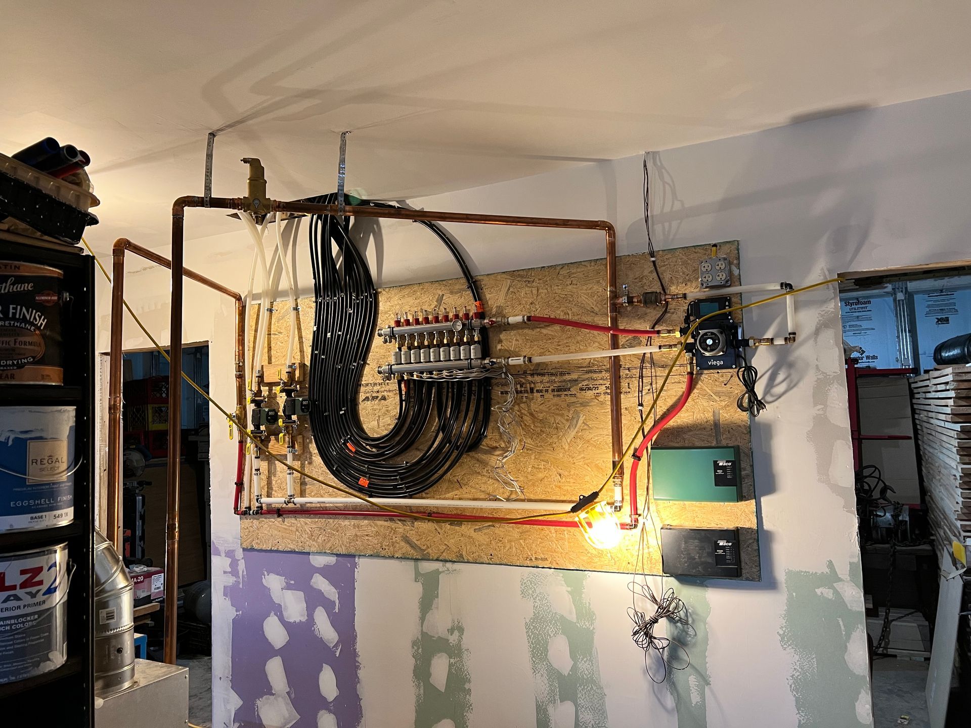 A room with a lot of wires hanging from the ceiling.