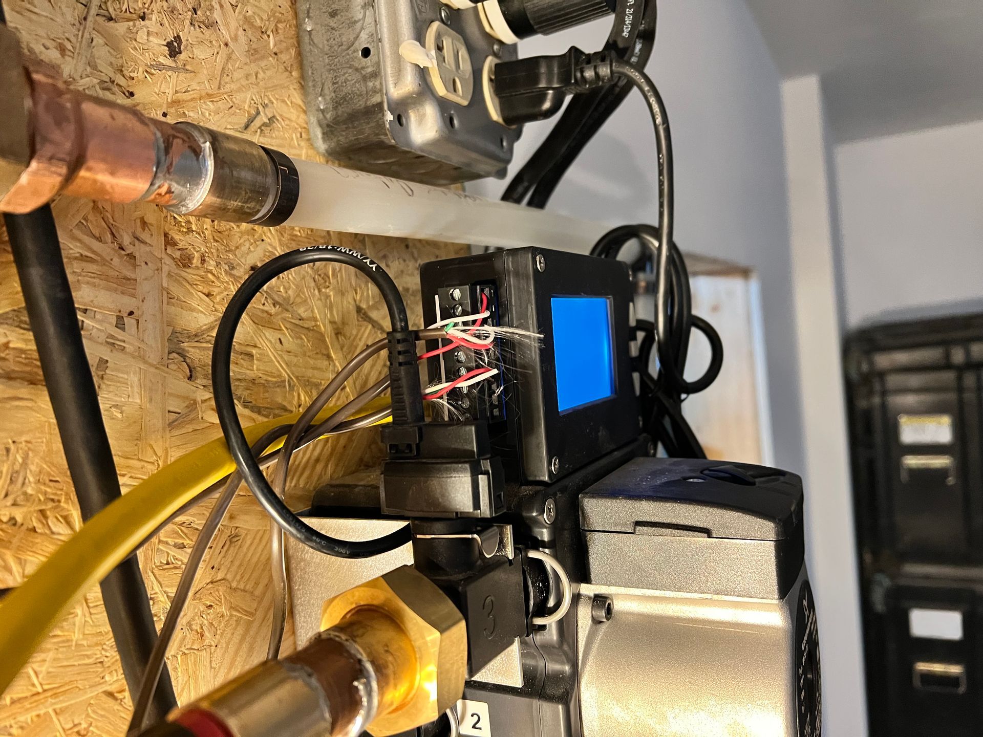 A bunch of wires are connected to a machine.