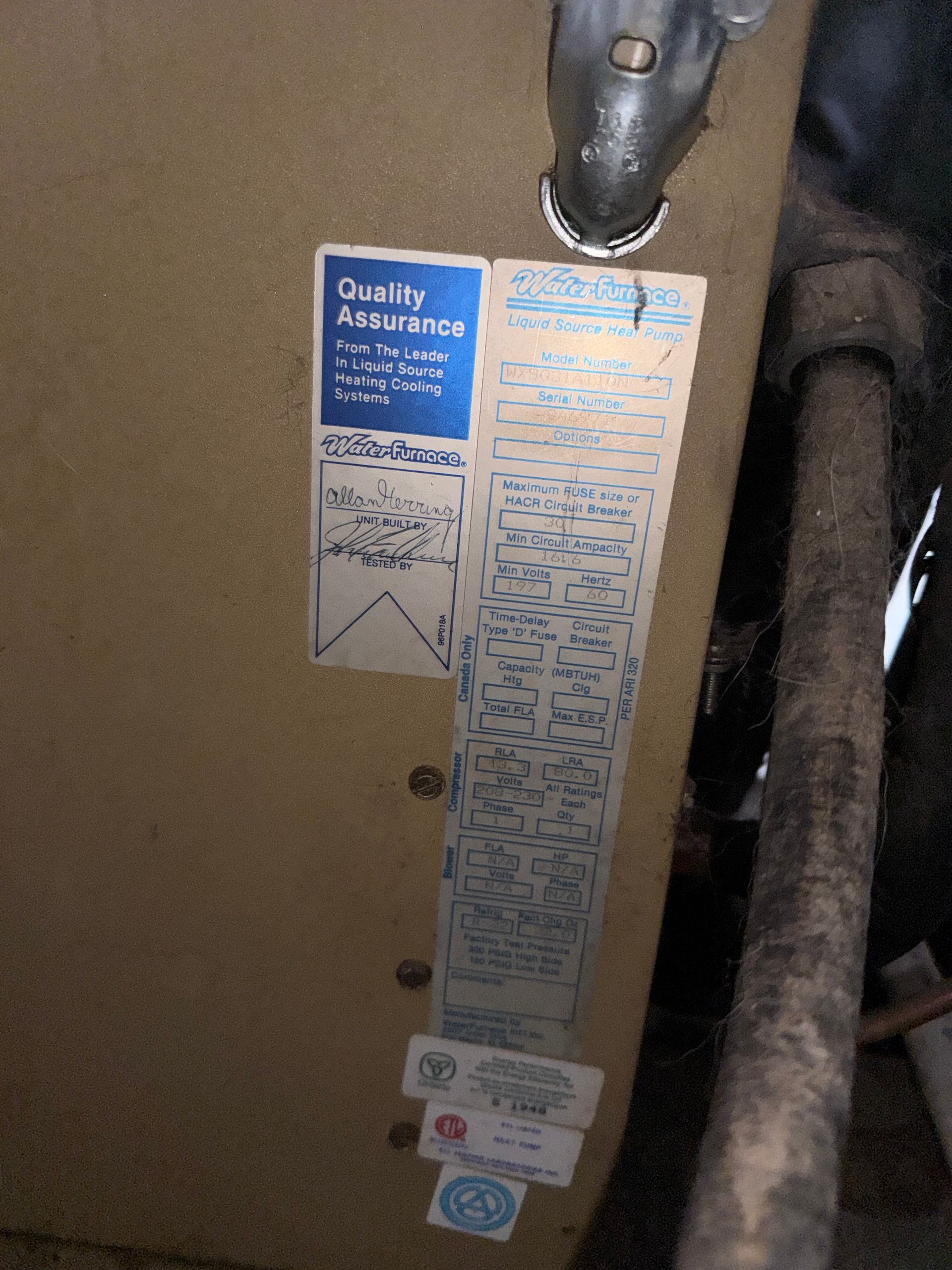 A piece of wood with a sticker on it that says quality assurance