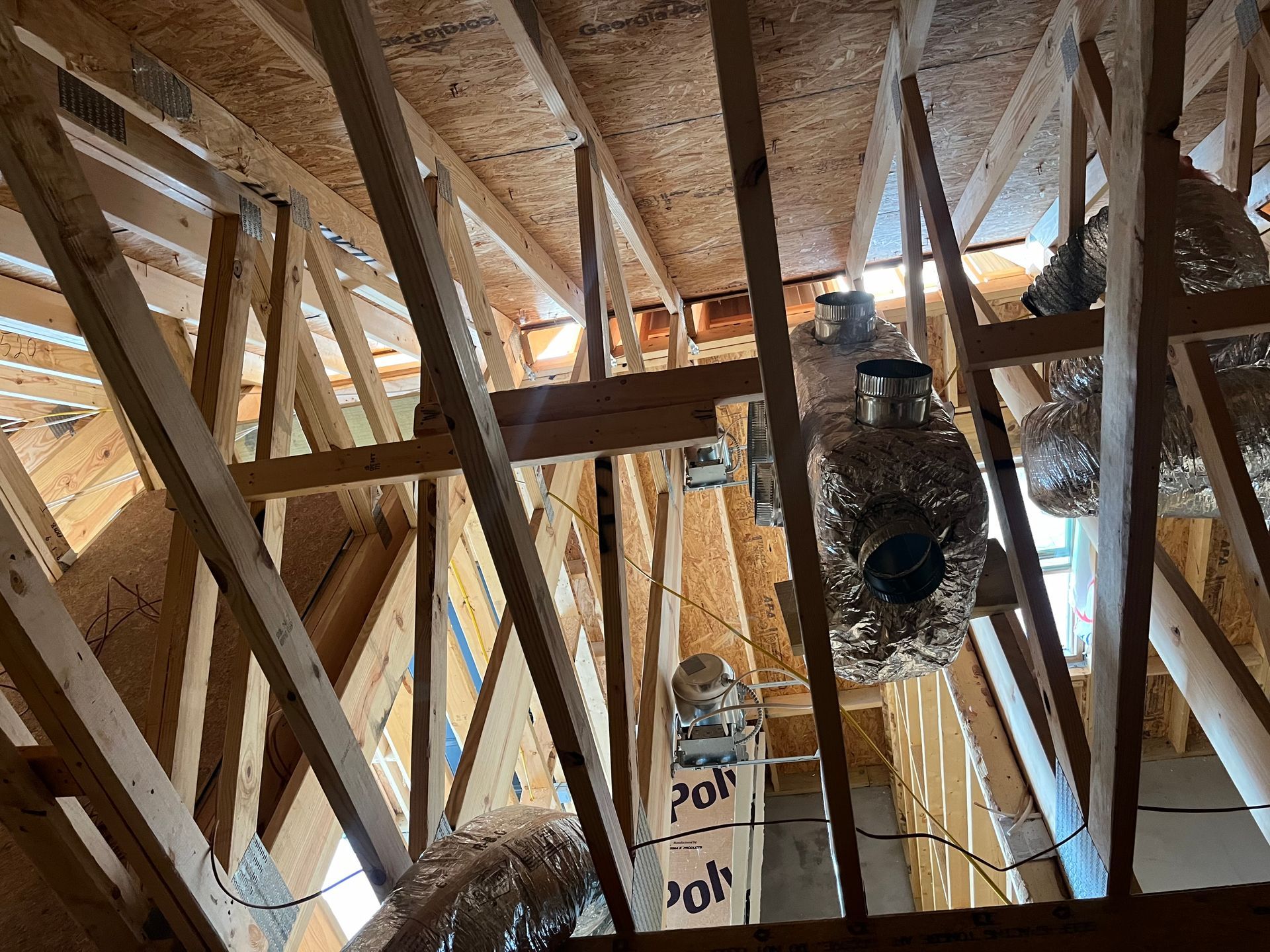 Looking up at the ceiling of a house under construction.