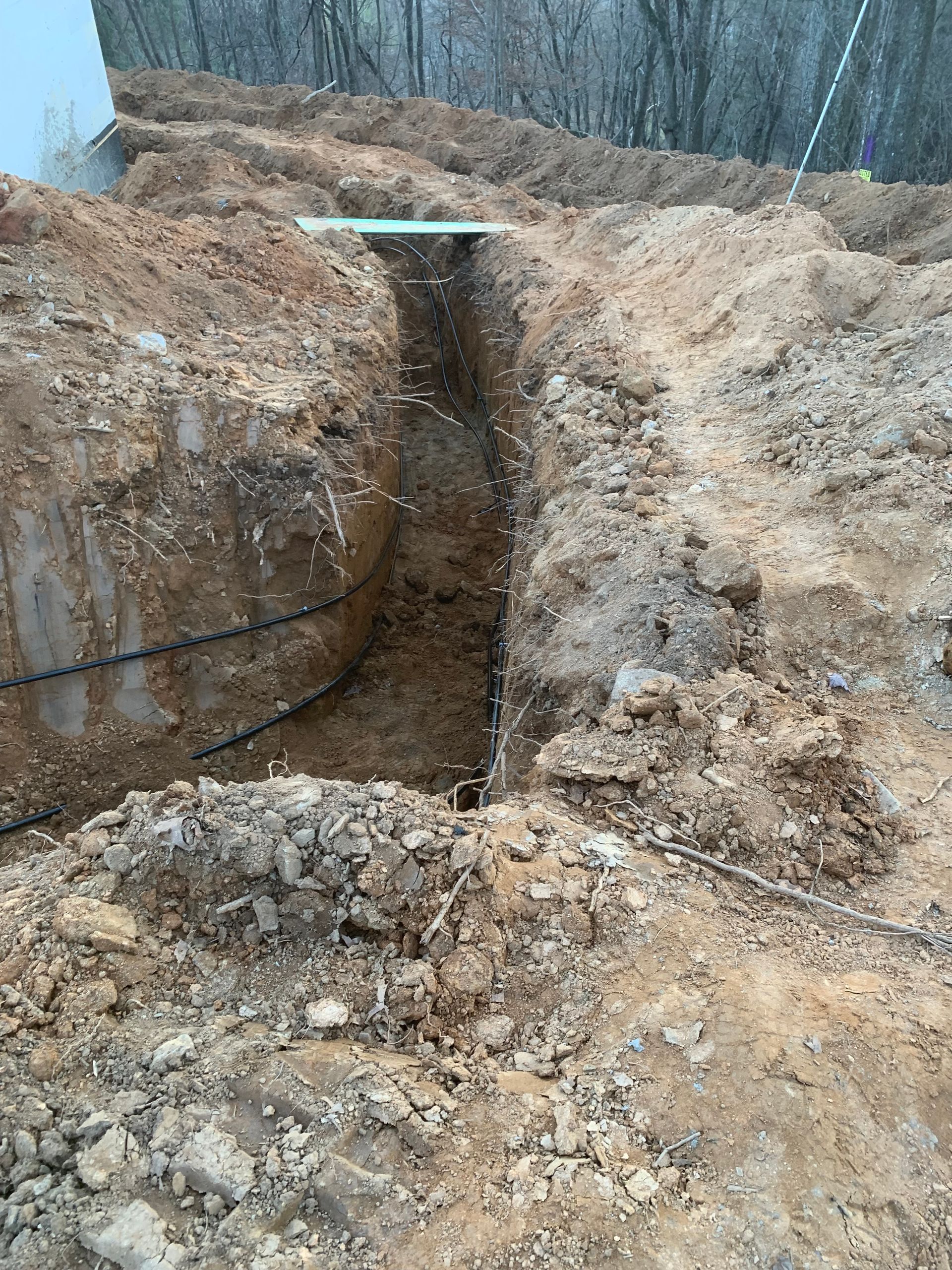 A large pile of dirt and rocks is being dug up.