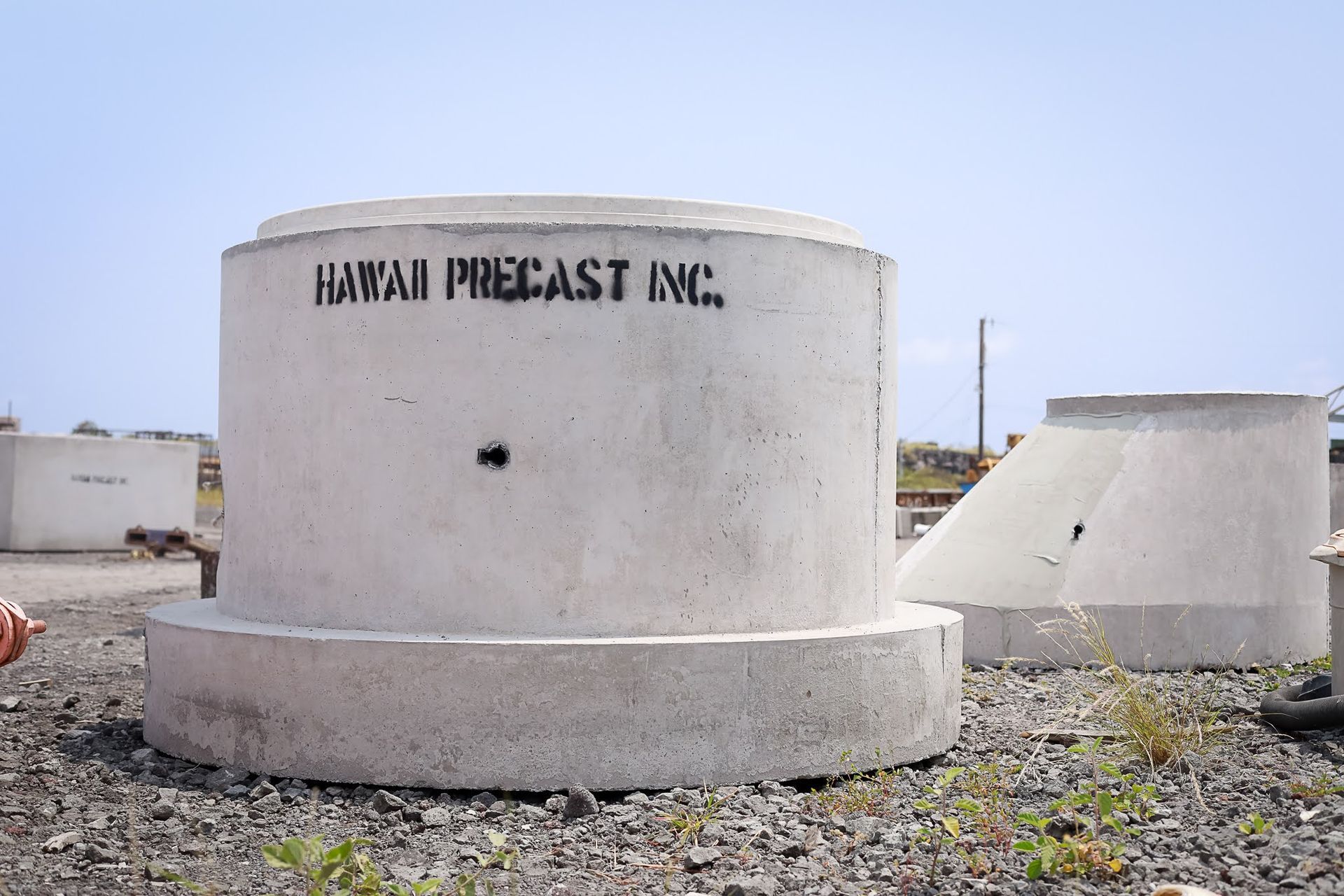 White industrial tank labeled 