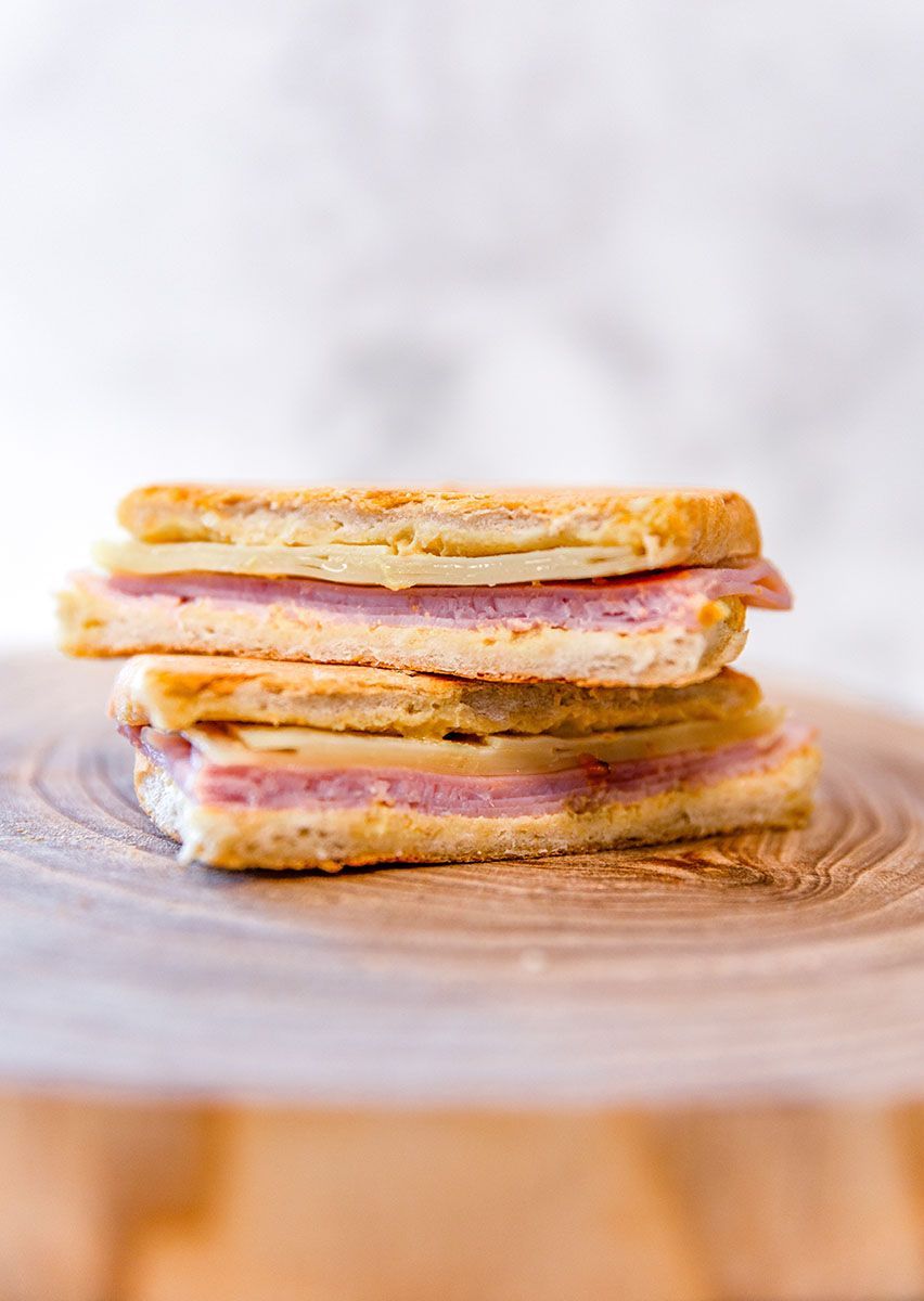A delicious panini on a wooden cutting board