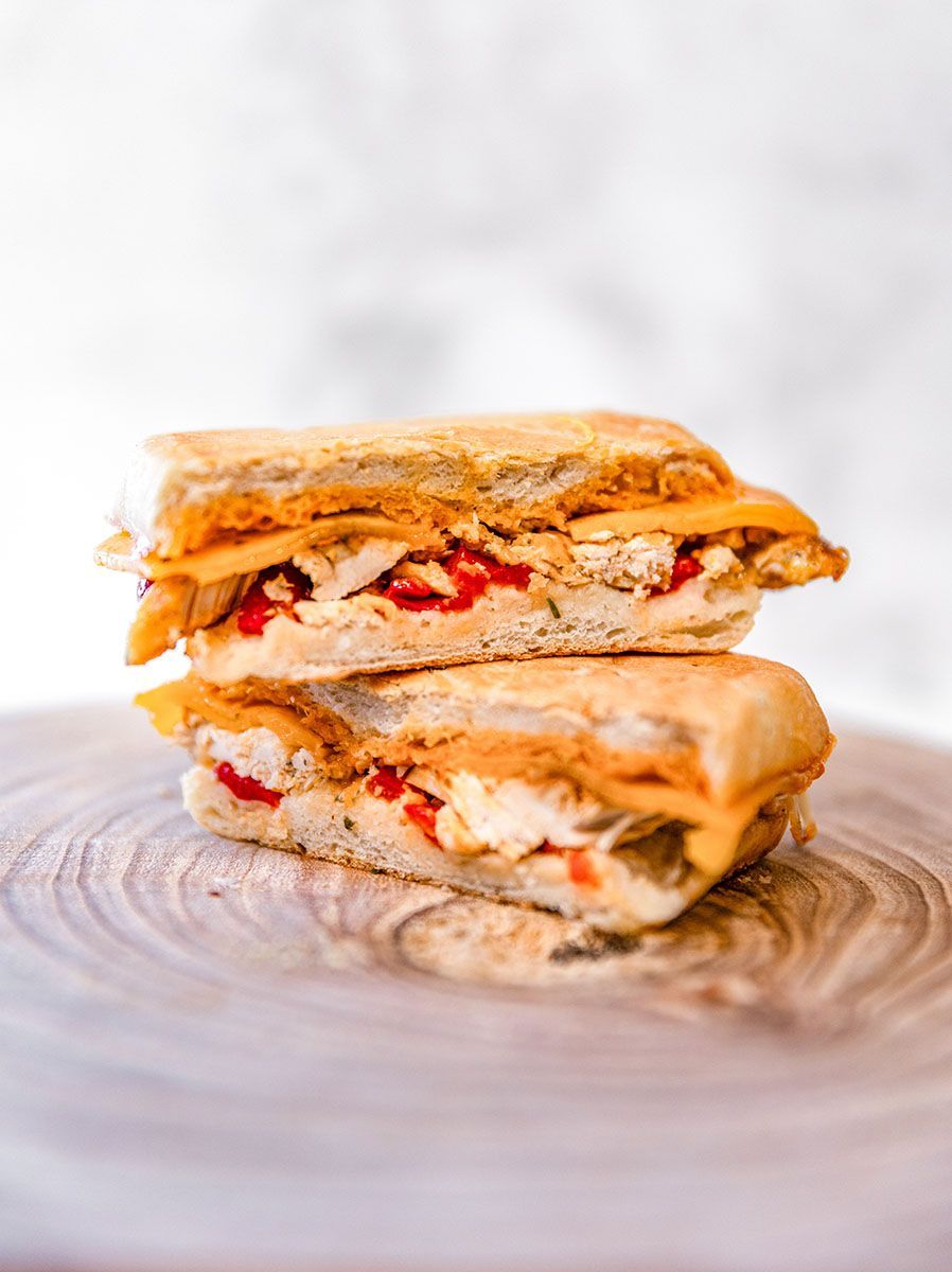 Delectable paninis on a wooden cutting board