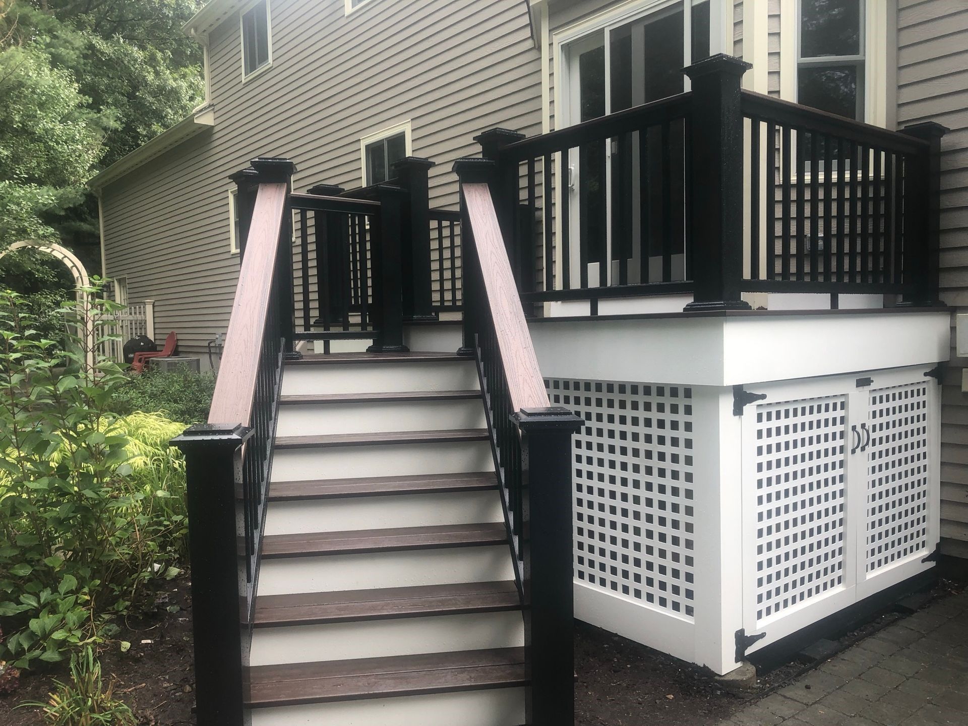 a black and white deck with stairs leading up to it