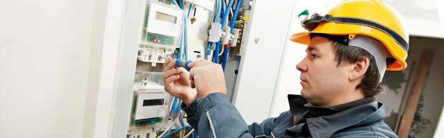 electrician working on electrical wirings